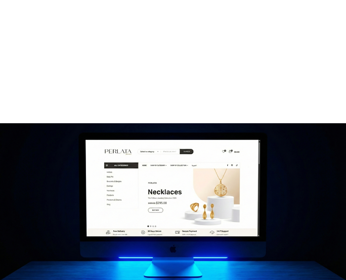 Professional e-commerce website interface for a luxury jewelry brand displayed on a sleek desktop monitor with blue ambient lighting.