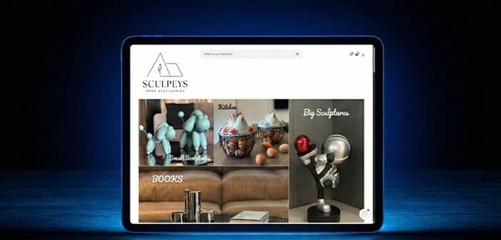Modern tablet displaying a home accessories e-commerce store featuring categories for small sculptures, kitchenware, and books.